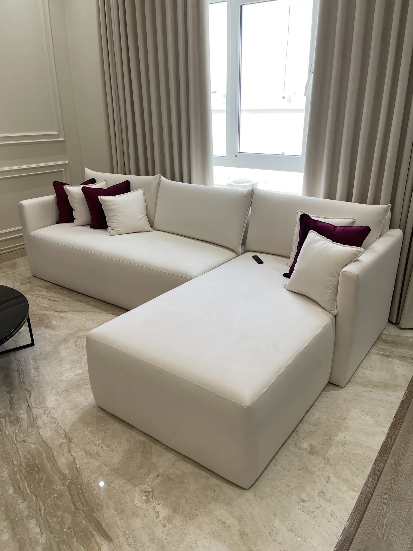 Close angled view of chaise and upholstered cushions.