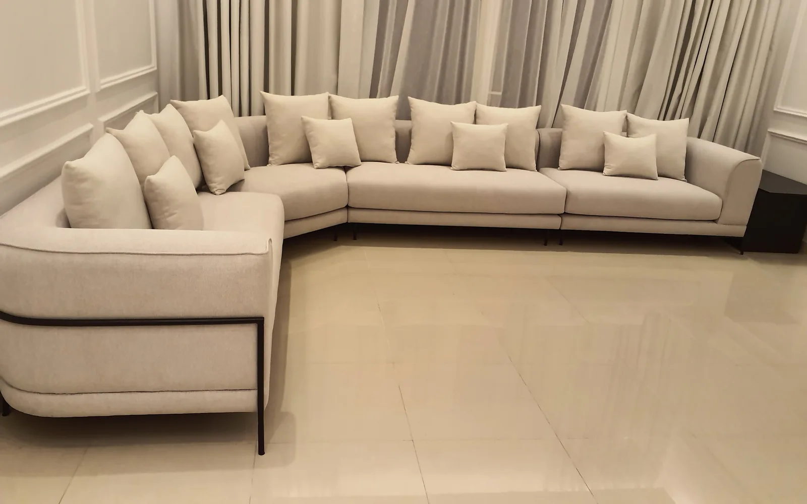 Pale curved sectional.
