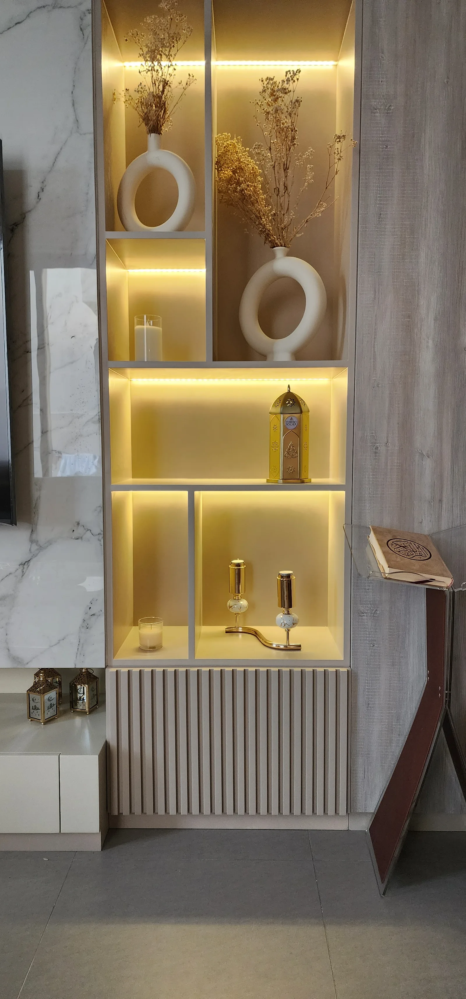 Full illuminated right display tower with fluted lower cabinet.