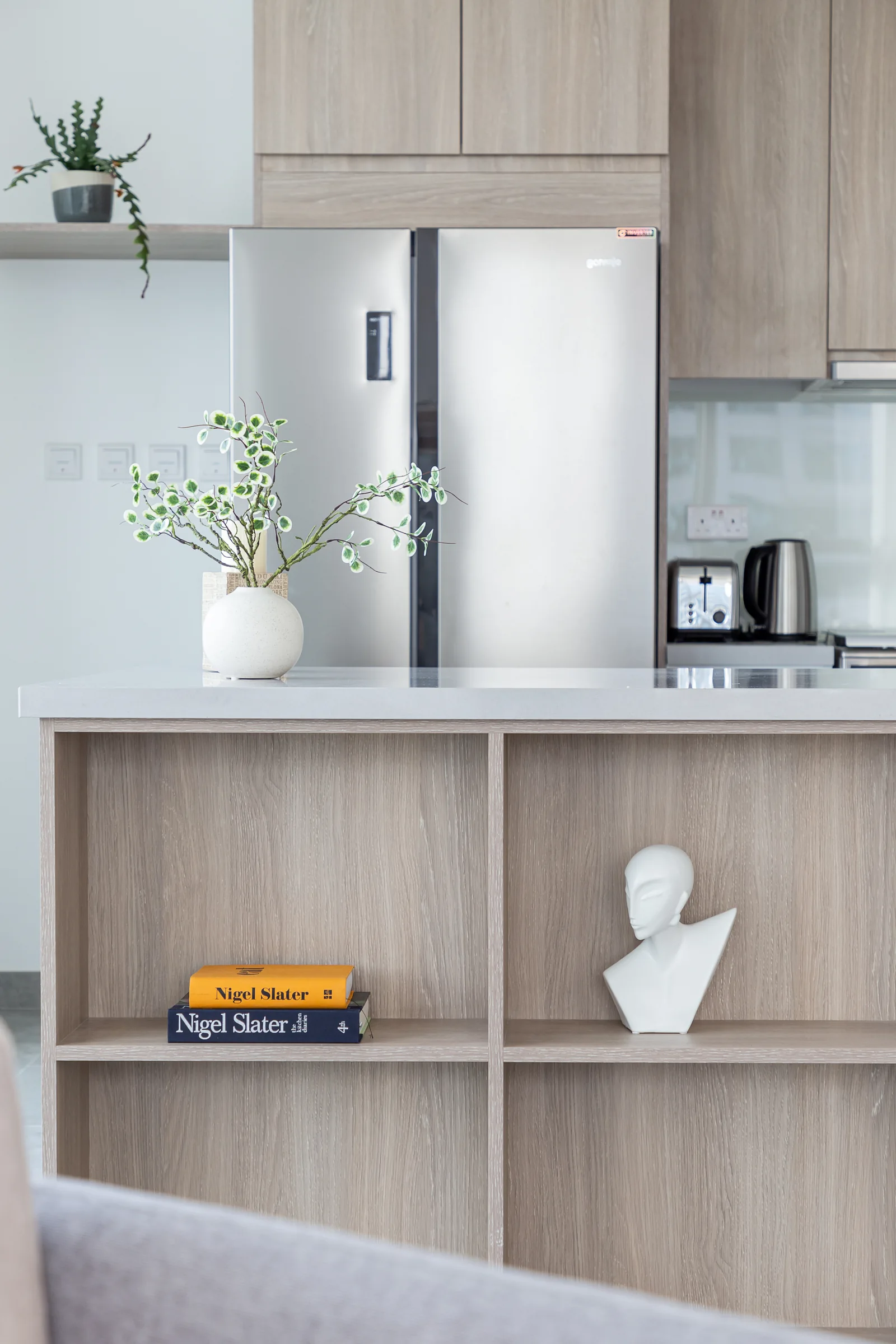 Kitchen island shelving and cabinetry.