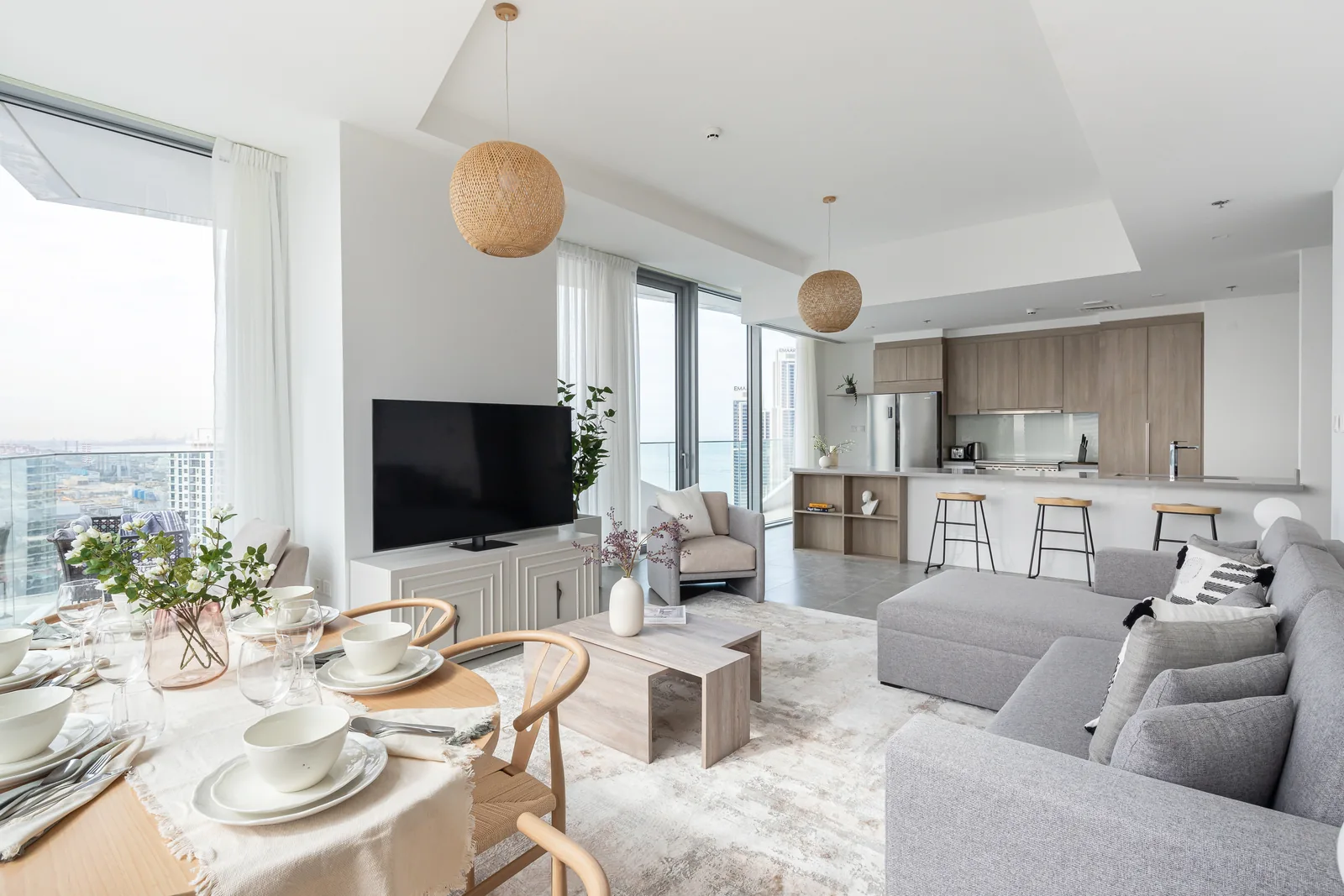 Open-plan lounge, dining setting and kitchen.