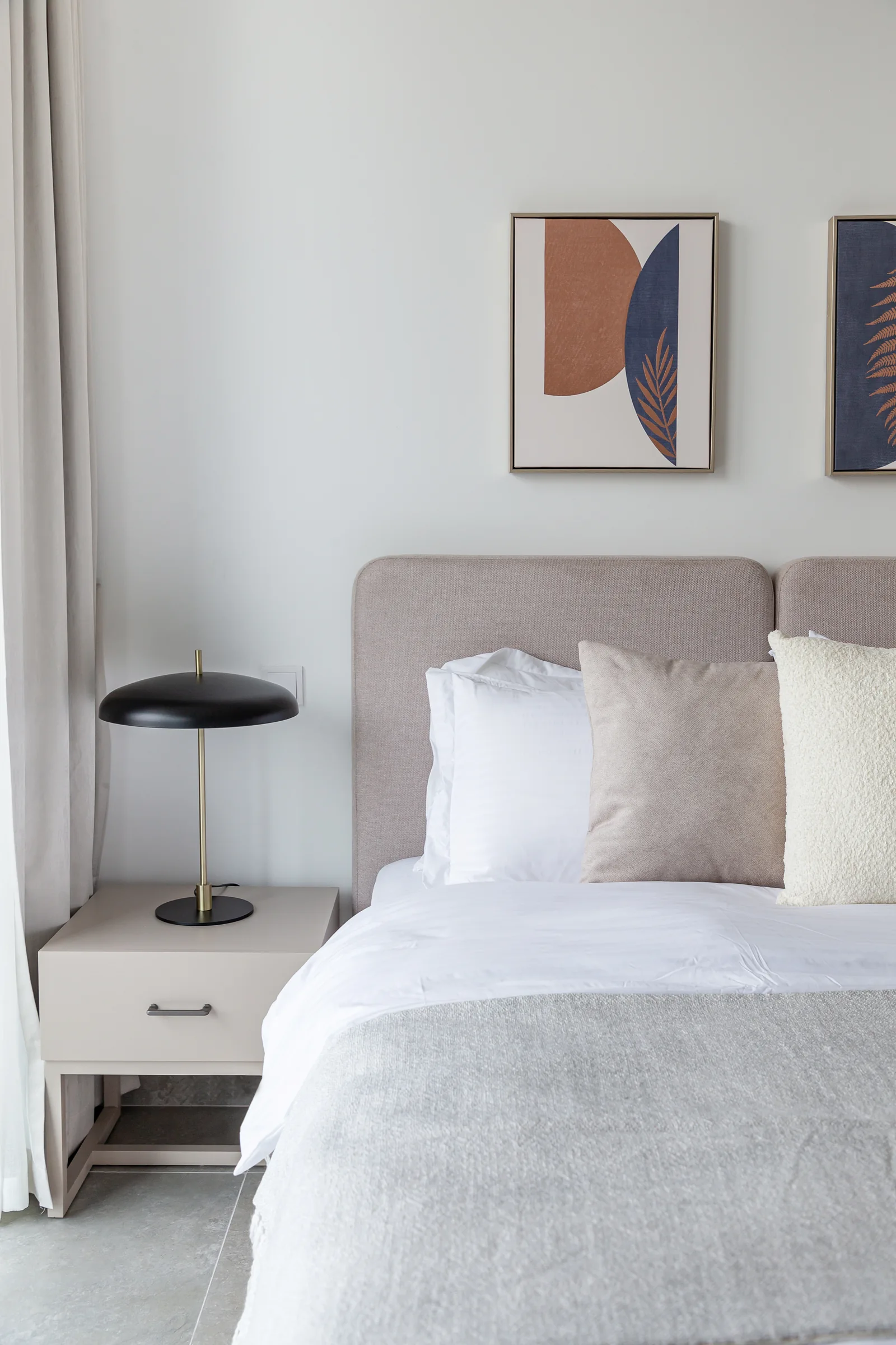 Second-bedroom headboard, bedside cabinet and lamp.