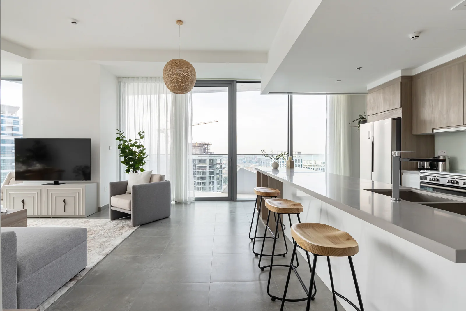 Kitchen island, sculpted stools and lounge.