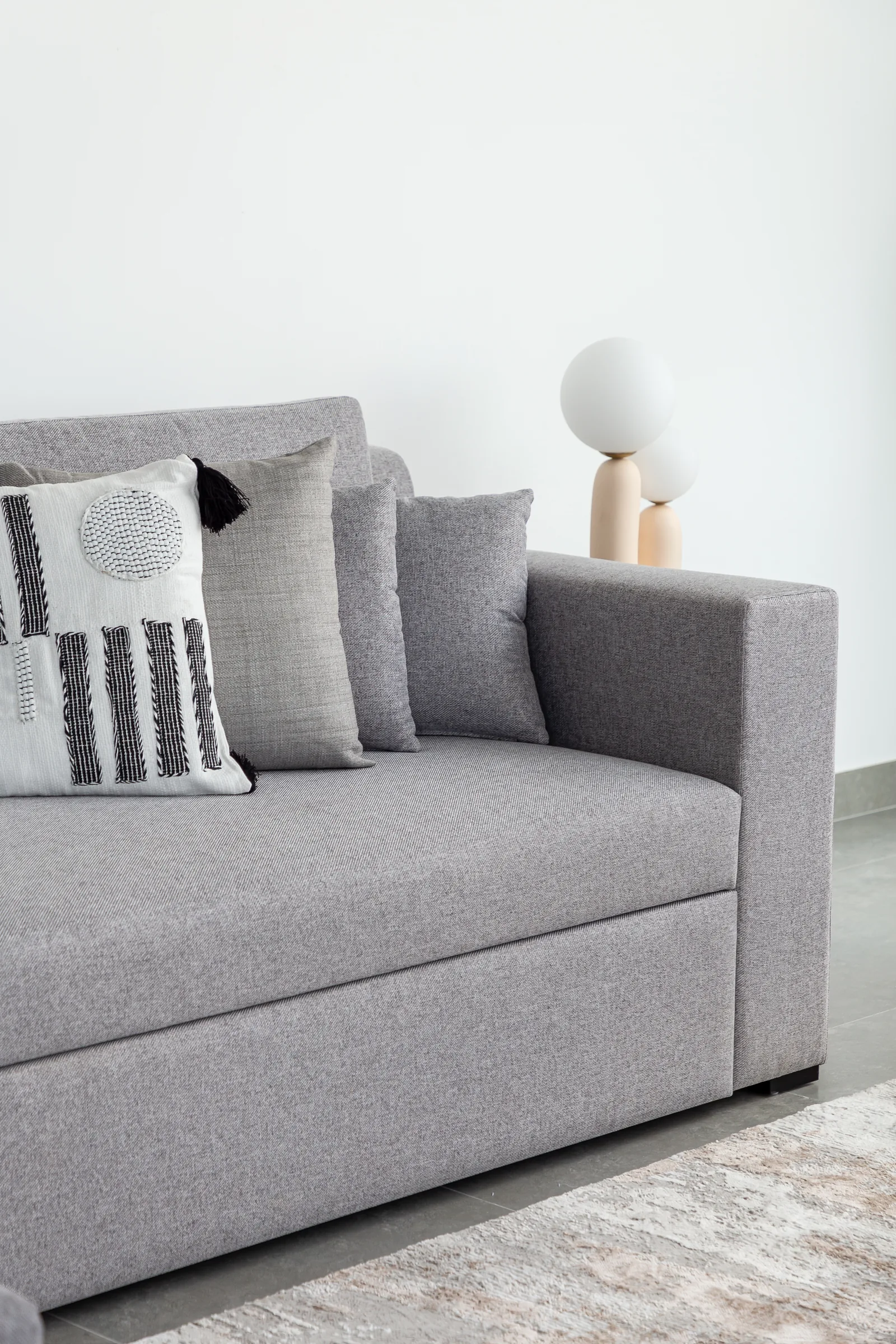 Sofa upholstery and textured cushions.