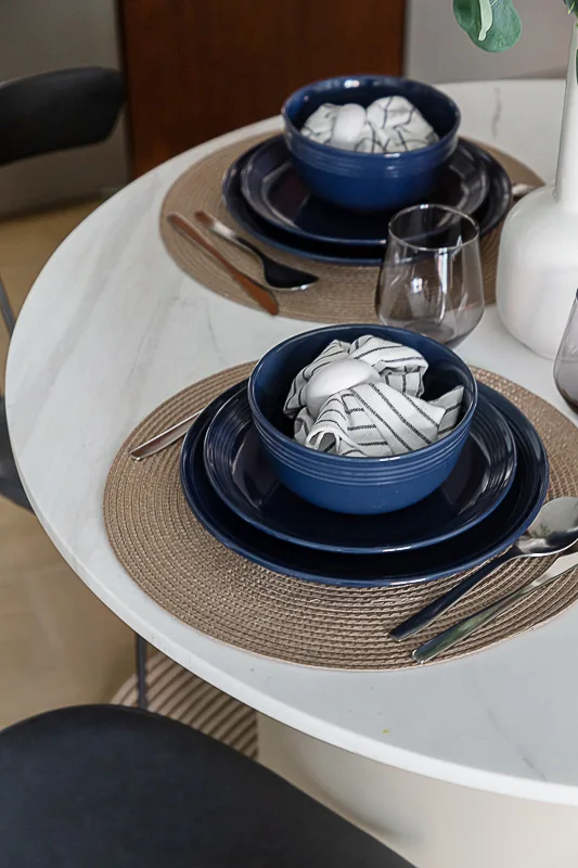 Table surface and coordinated dining setting.