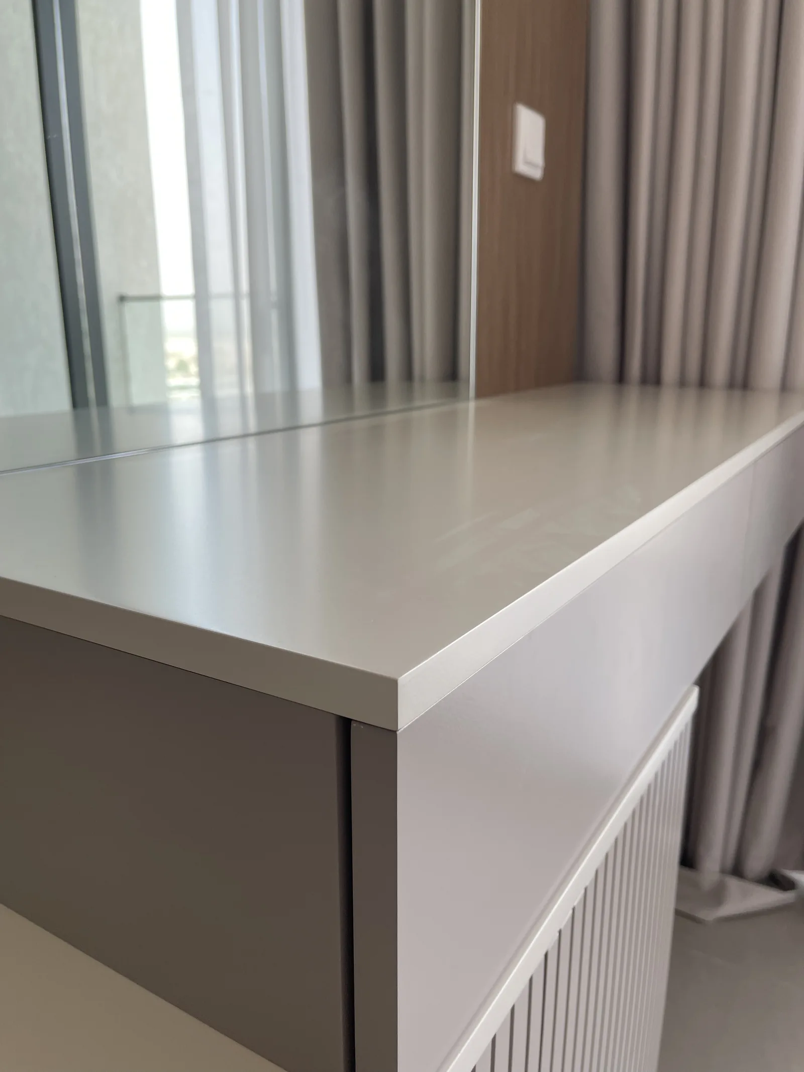 Dressing console worktop edge and drawer front.