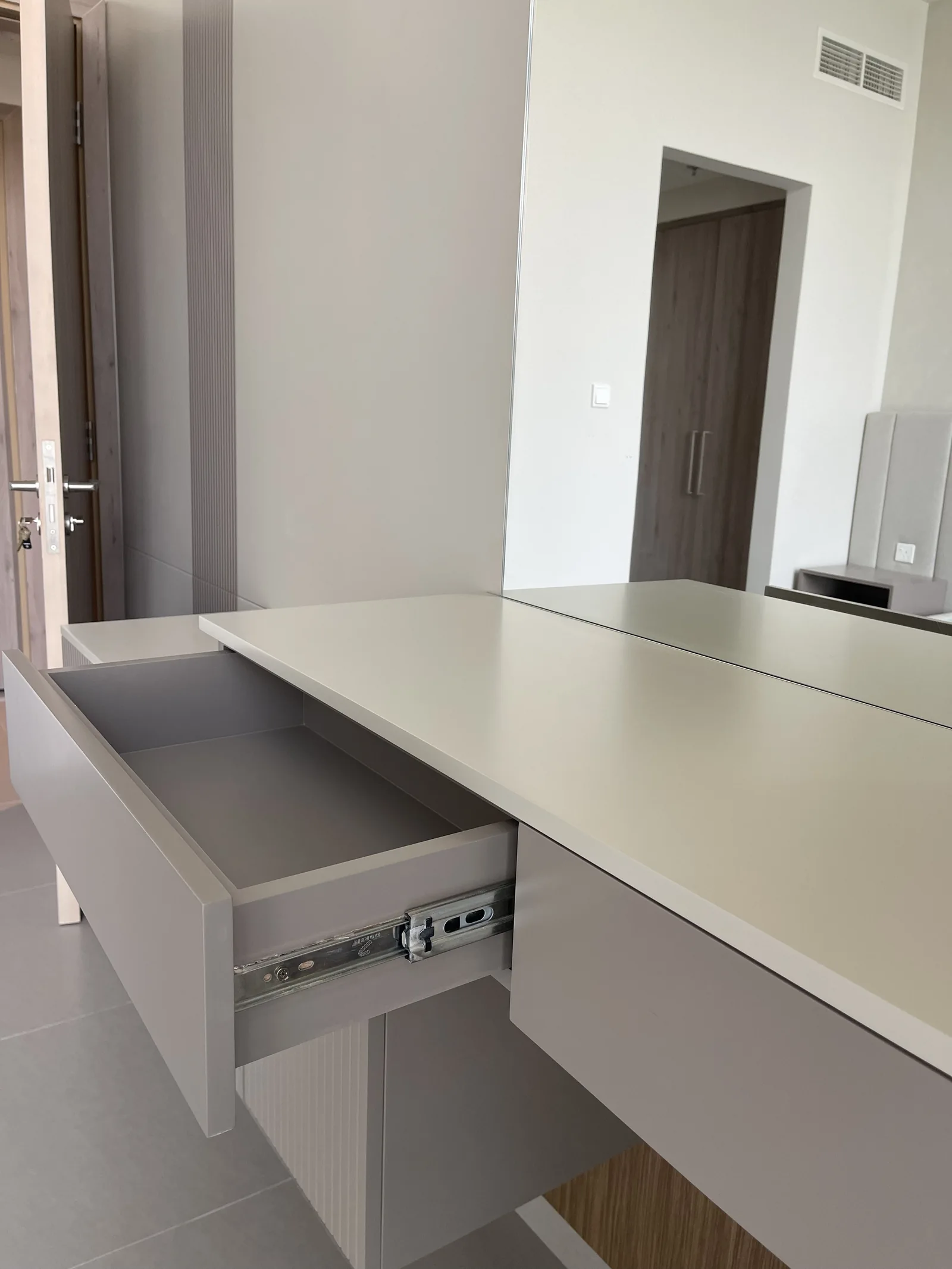 Dressing console with a drawer pulled open.