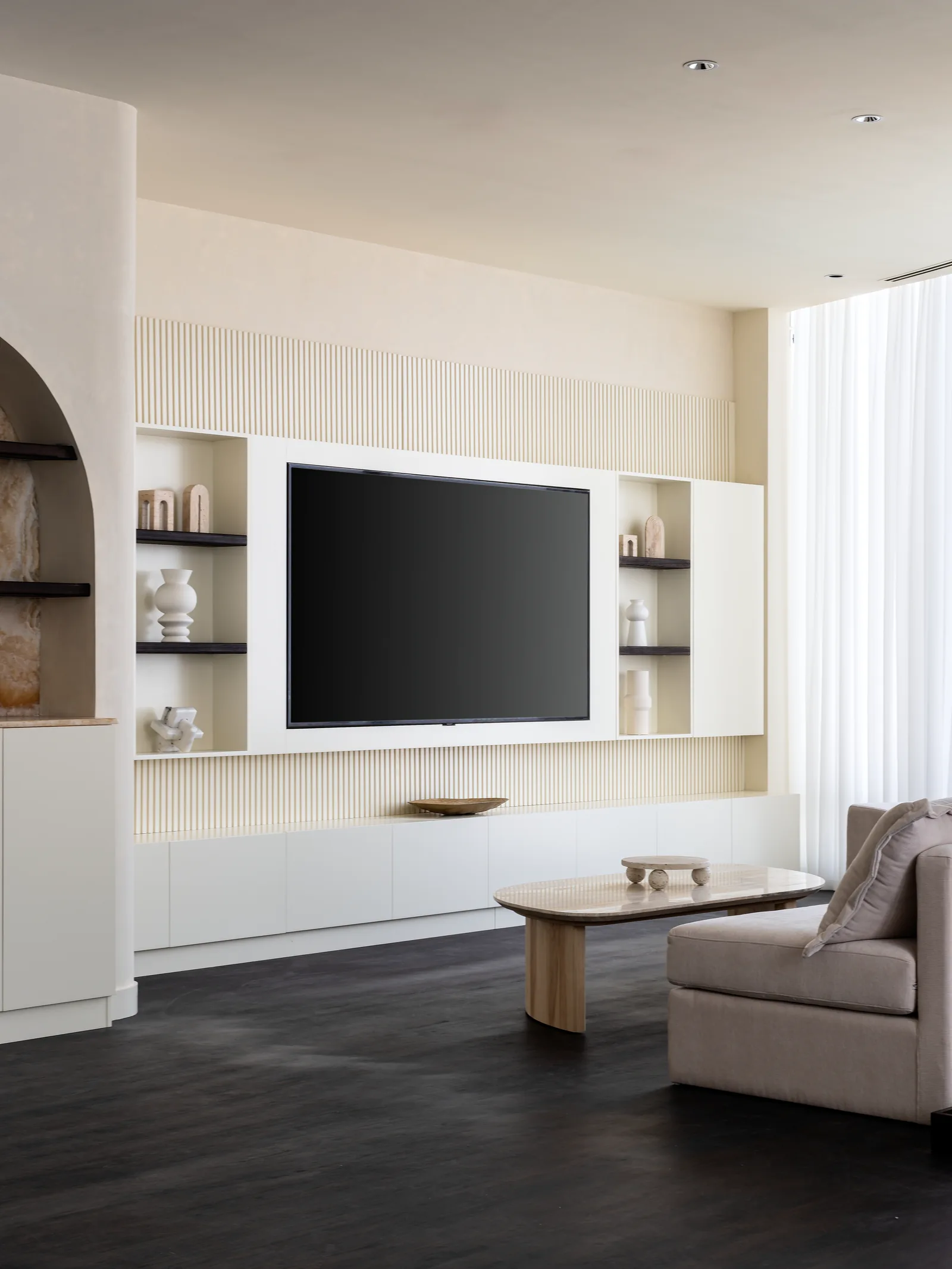 Living room, fluted TV-wall joinery and table.