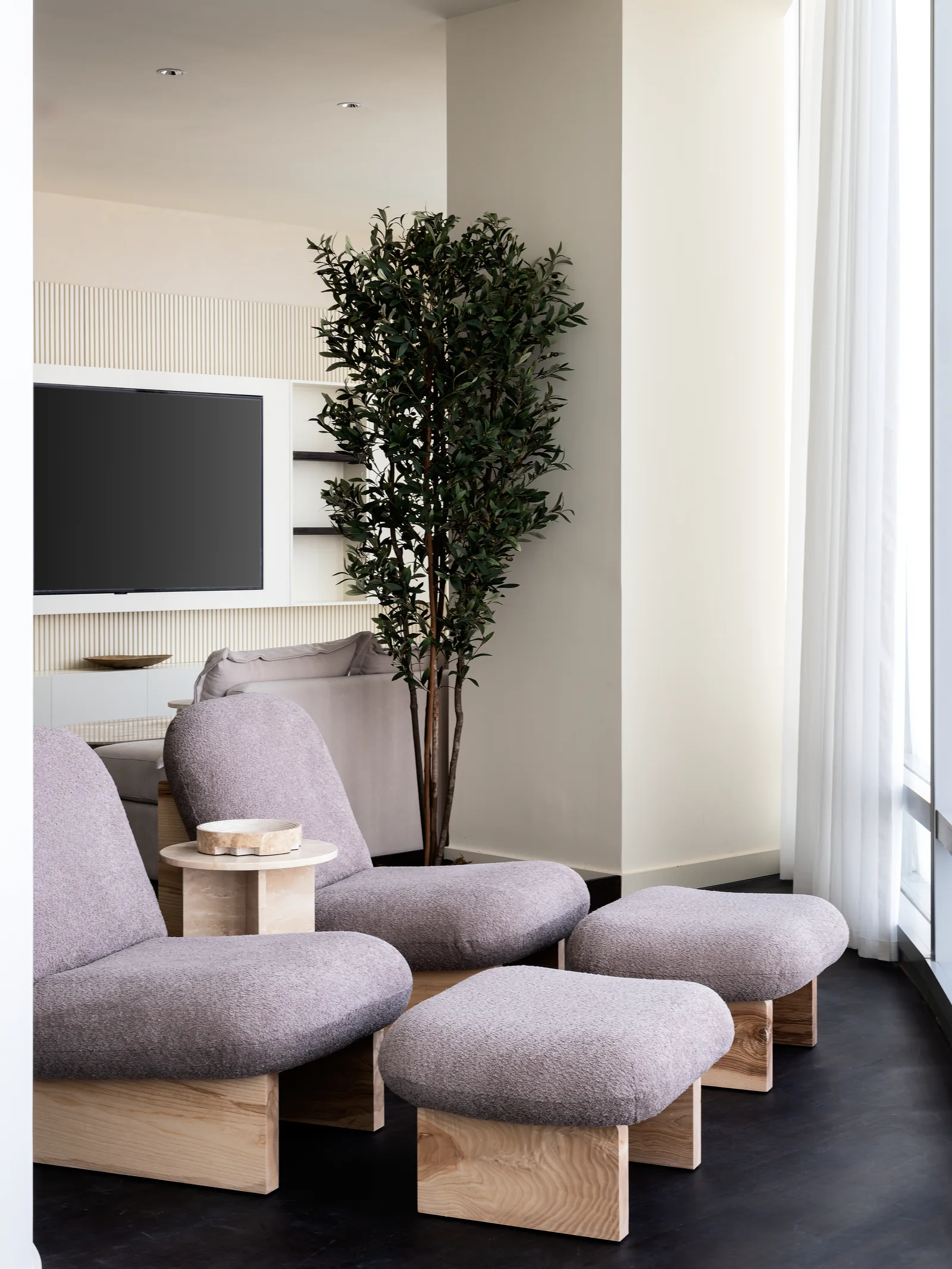 Pair of upholstered lounge chairs, ottomans and side table.