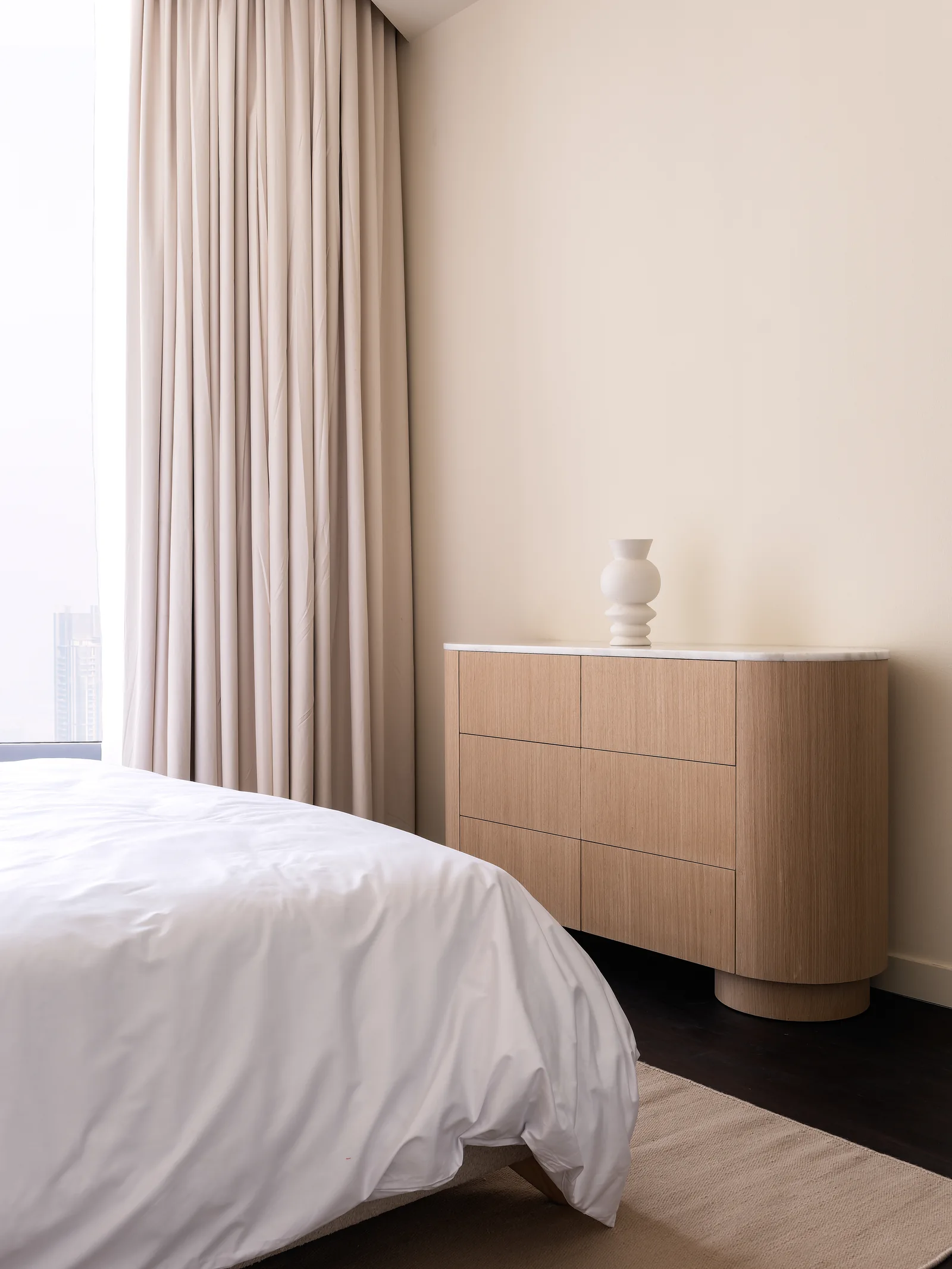 Rounded chest of drawers and top.