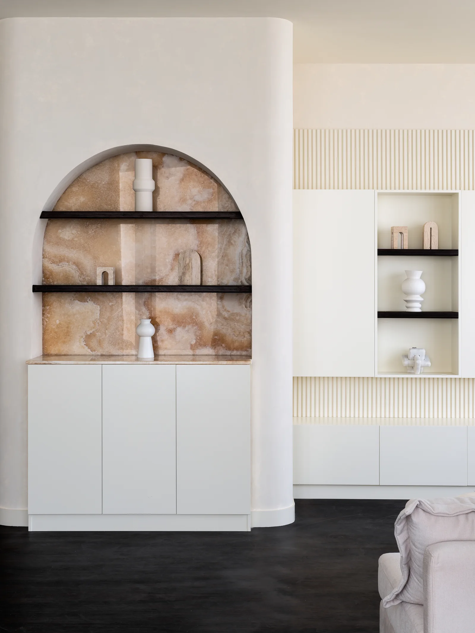 Arched shelves and fluted joinery.